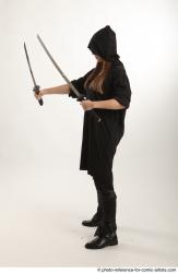 Woman Adult Average White Fighting with sword Standing poses Coat